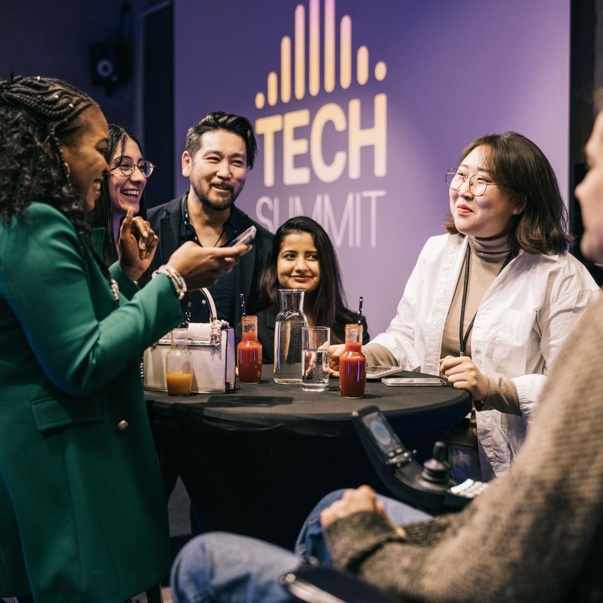 Tech Summit people talking round a table